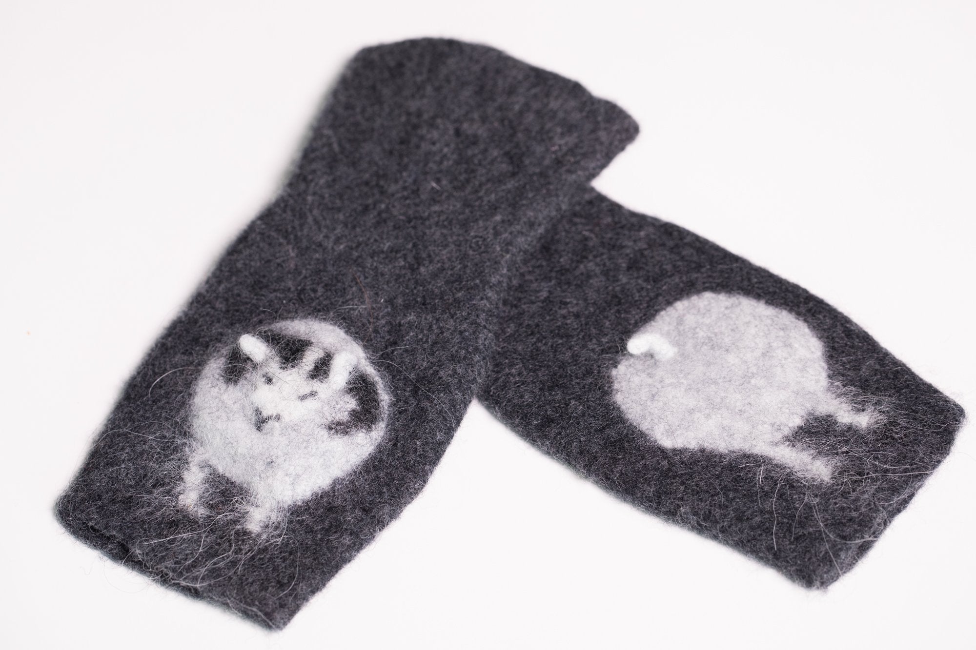 Warm and soft half mittens with cute sheep pattern. Handmade in Iceland. Colour charcoal.