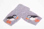 Warm and soft fingerless half mittens with a hand felted little puffin. Colour grey mix.